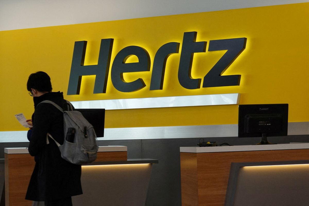 person-walks-counter-hertz-rental-car-john-f-kennedy-international-airport-queens-new-york.jpg