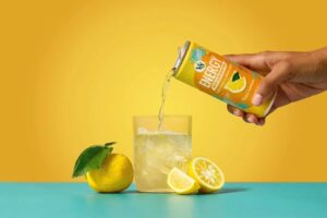 F26_V8_Energy_Yuzu-Lemon_Photography_Lifestyle-Gradient-w-Can-Pour_Uncropped_v1-1.jpg